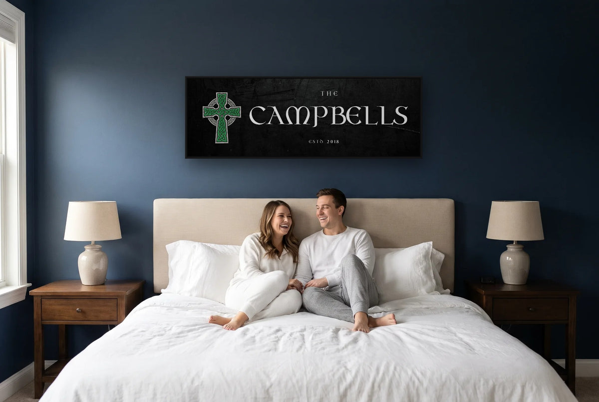 Celtic Cross family name canvas above a bed on a navy bedroom wall